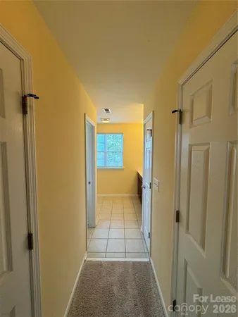 a view of a hallway with a livingroom