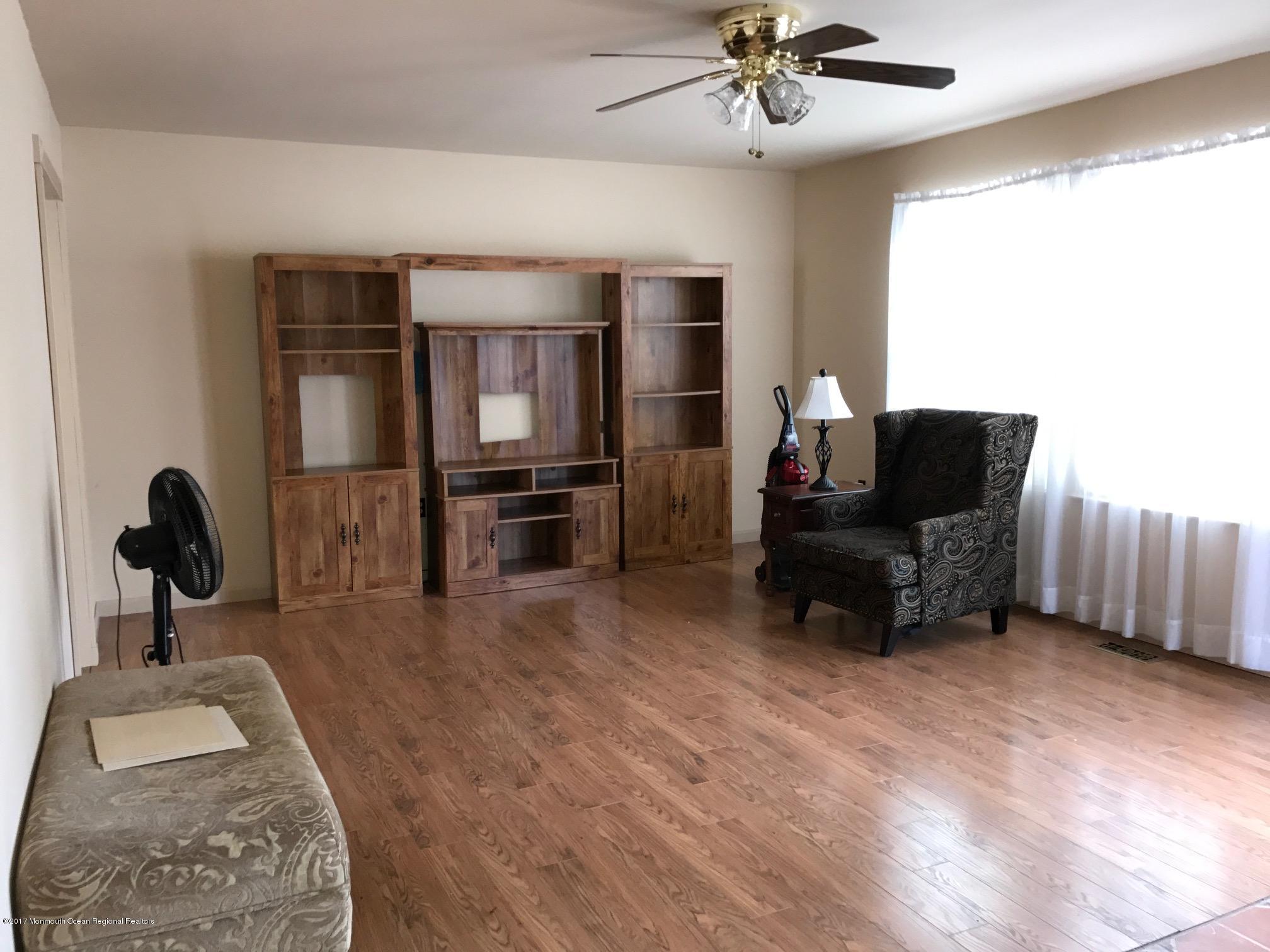 61 Korman Road Bayville, NJ 08721 - Photo 4 of 10 a living room with furniture and a flat screen tv