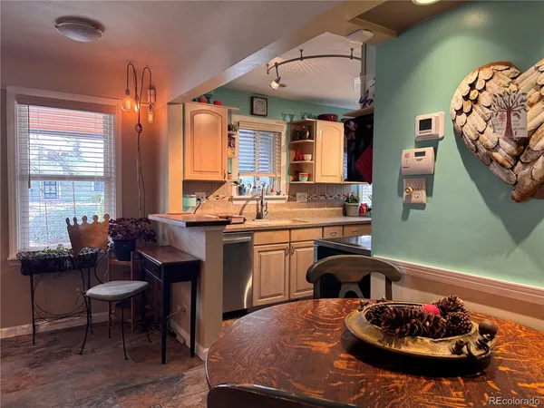 a kitchen with a table and chairs in it