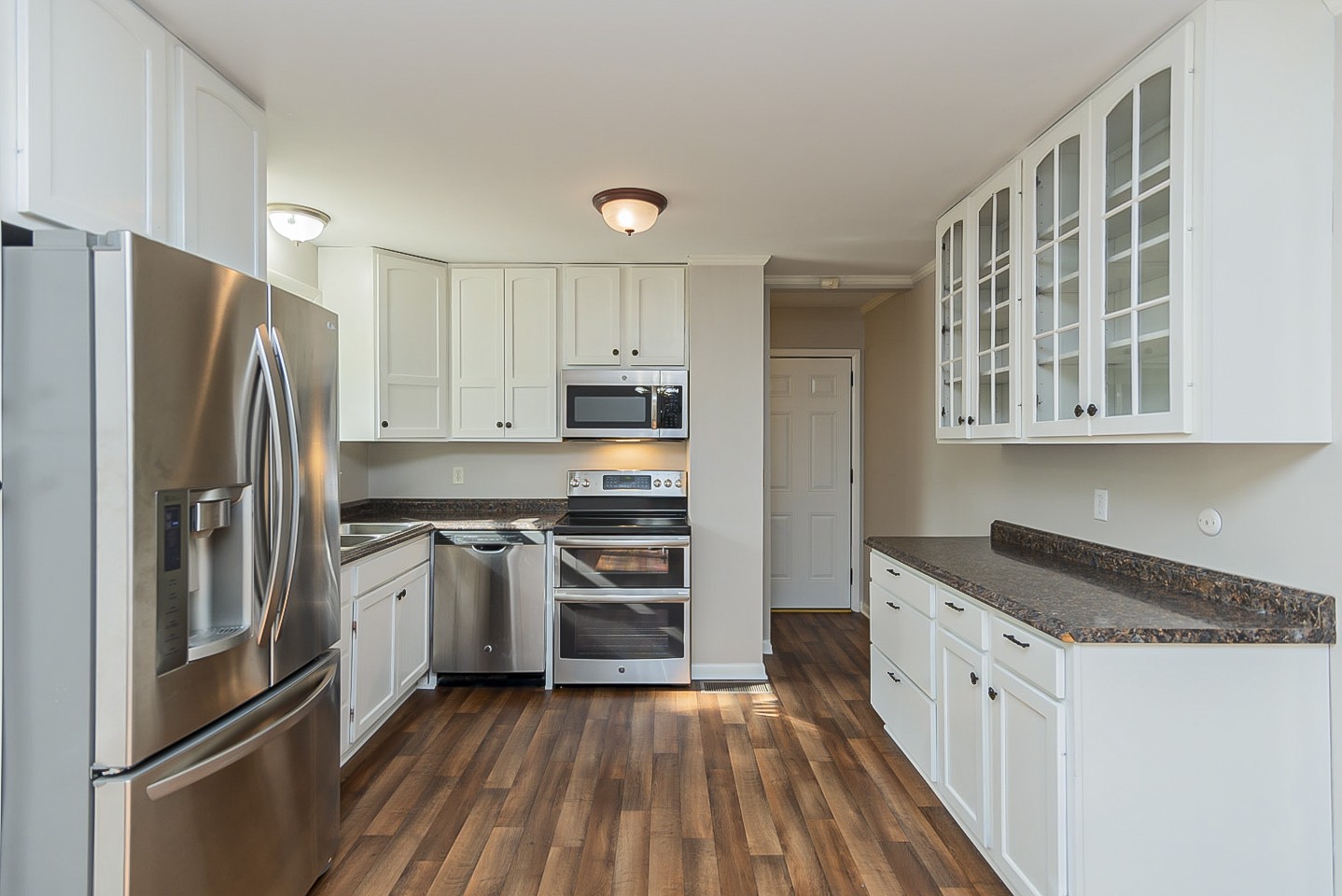 3121 Boulder Park Drive Nashville, TN 37214 - Photo 4 of 20 a kitchen with stainless steel appliances granite countertop a refrigerator and a stove top oven