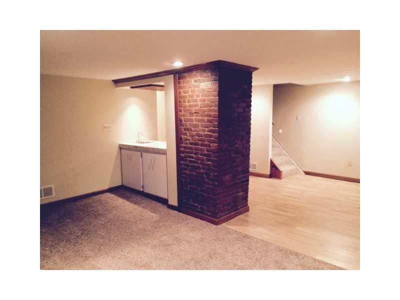 1923 Mt Troy Road Pittsburgh, PA 15212 - Photo 4 of 11 Living Room. A wet bar area enhances the living room!