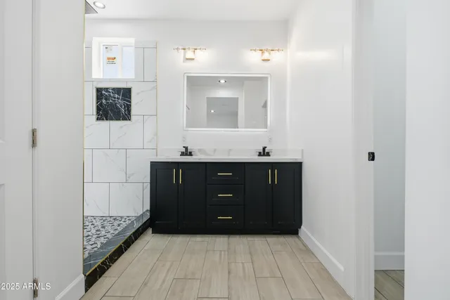 a bathroom with a sink and a mirror
