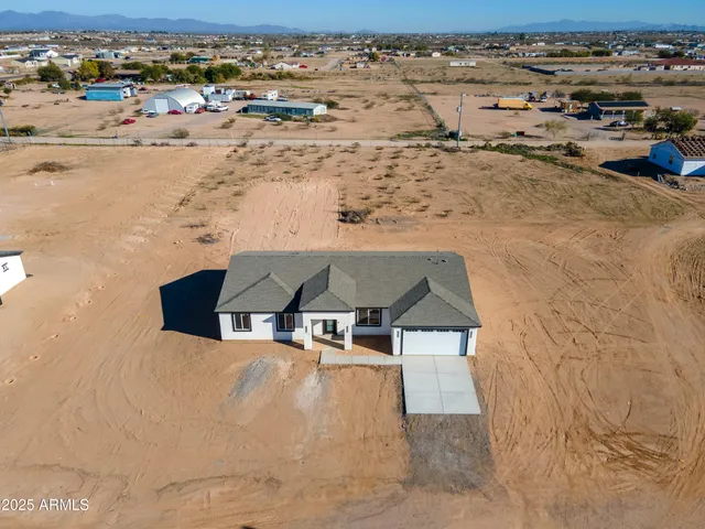an aerial view of a house with a outdoor space