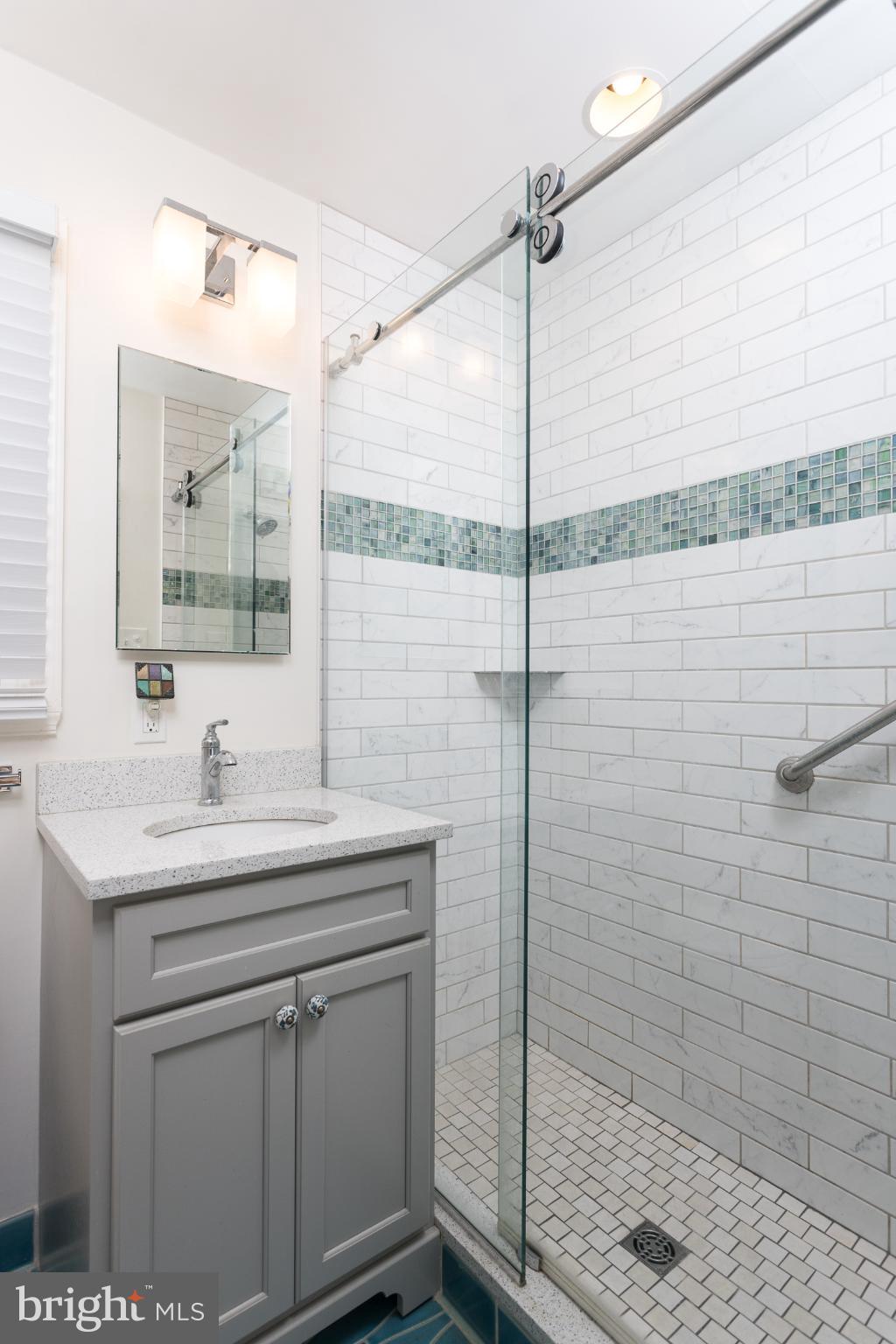 625 Dunkirk Road Baltimore, MD 21212 - Photo 15 of 39 Sleek modern bathroom with elegant tiles.