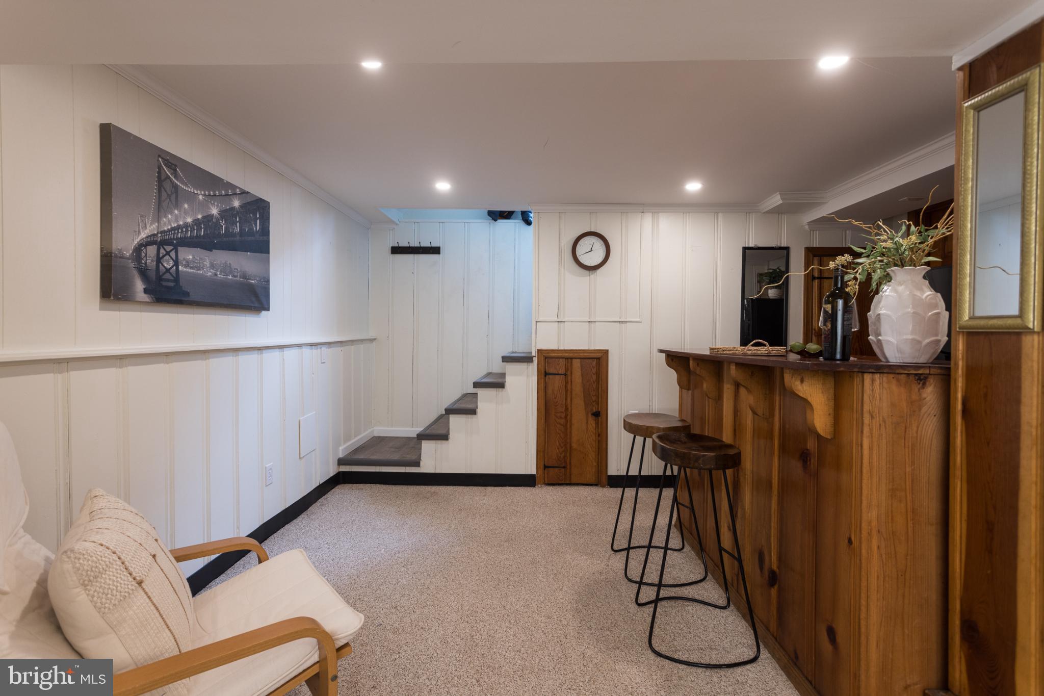 625 Dunkirk Road Baltimore, MD 21212 - Photo 30 of 39 Basement with a stylish bar. 3rd full BA not shown