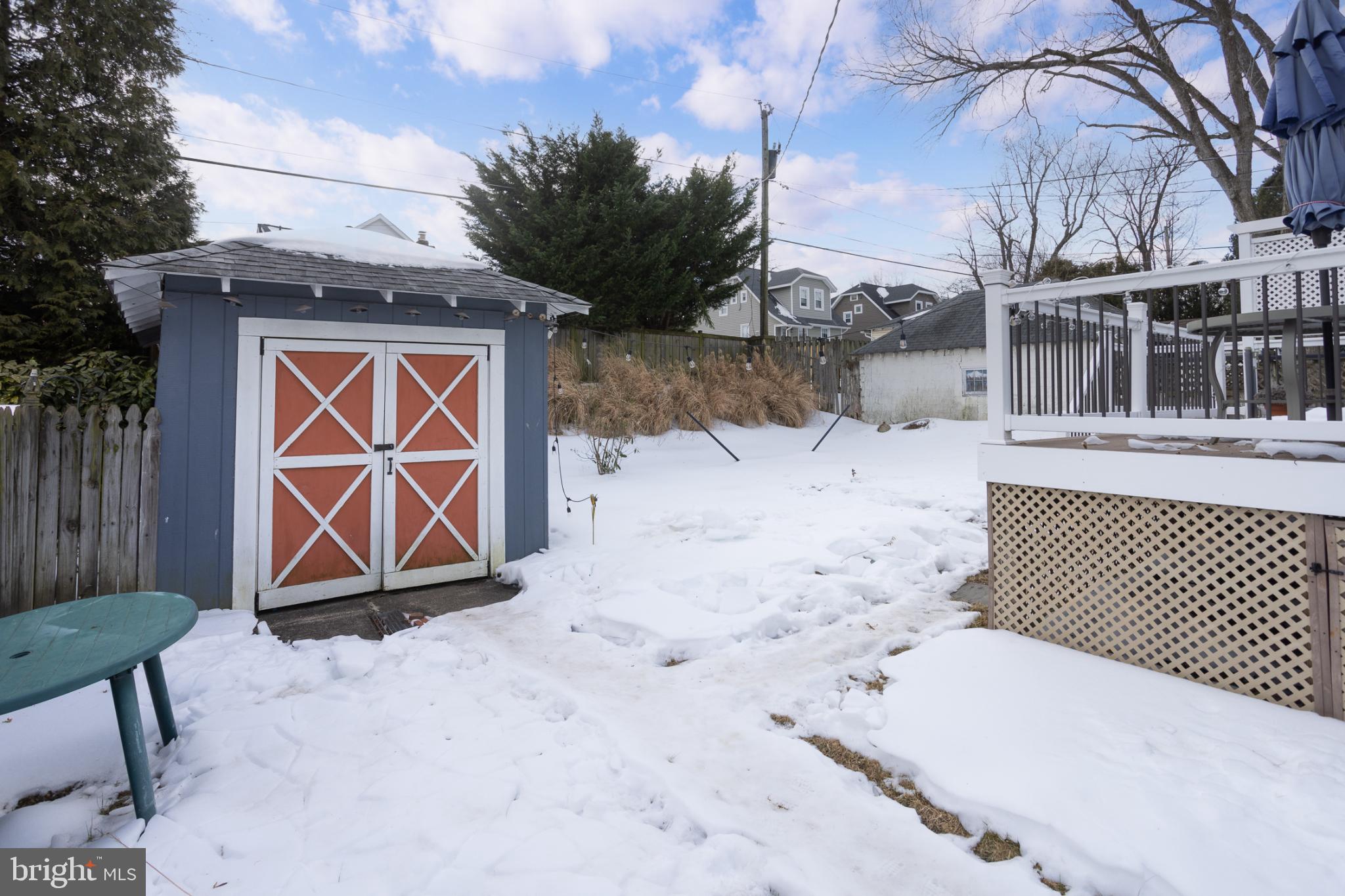 625 Dunkirk Road Baltimore, MD 21212 - Photo 35 of 39 Charming winter scene with a modest garage.