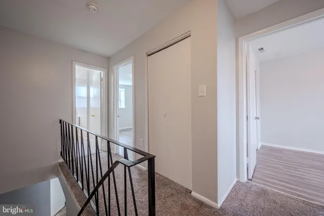 a view of a hallway with staircase