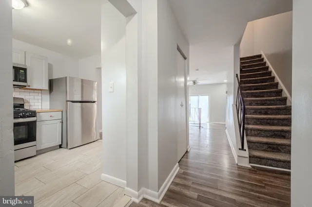 a view of kitchen and refrigerator