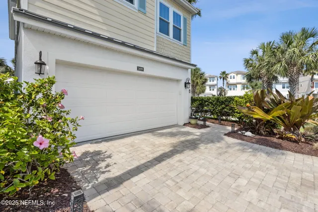 a living room kitchen with furniture and a large window