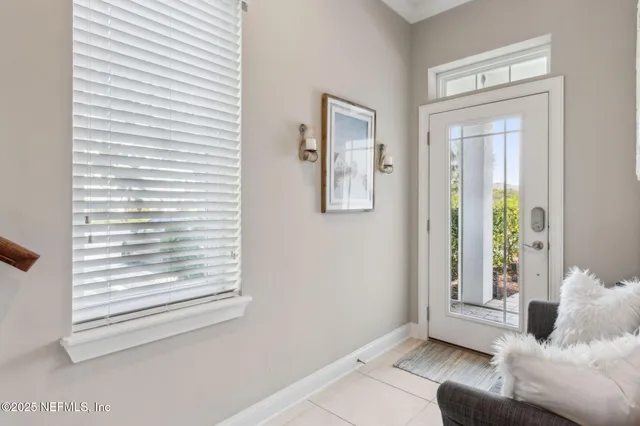 a view of a workspace with furniture and a flat screen tv