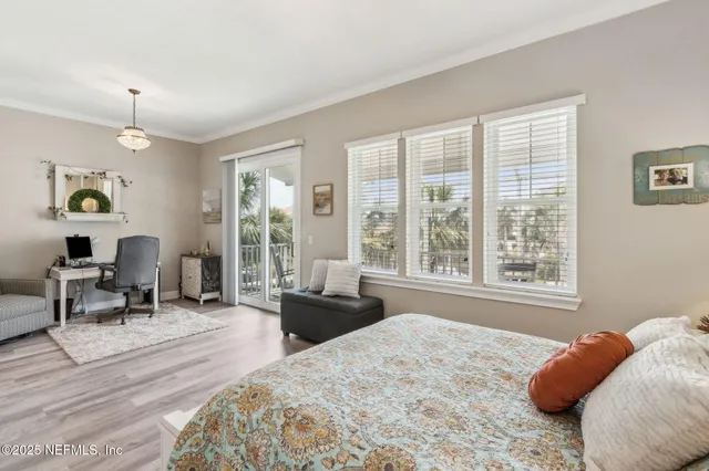 a building outdoor space with patio furniture and potted plants