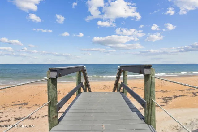 a view of swimming pool with outdoor seating and city view