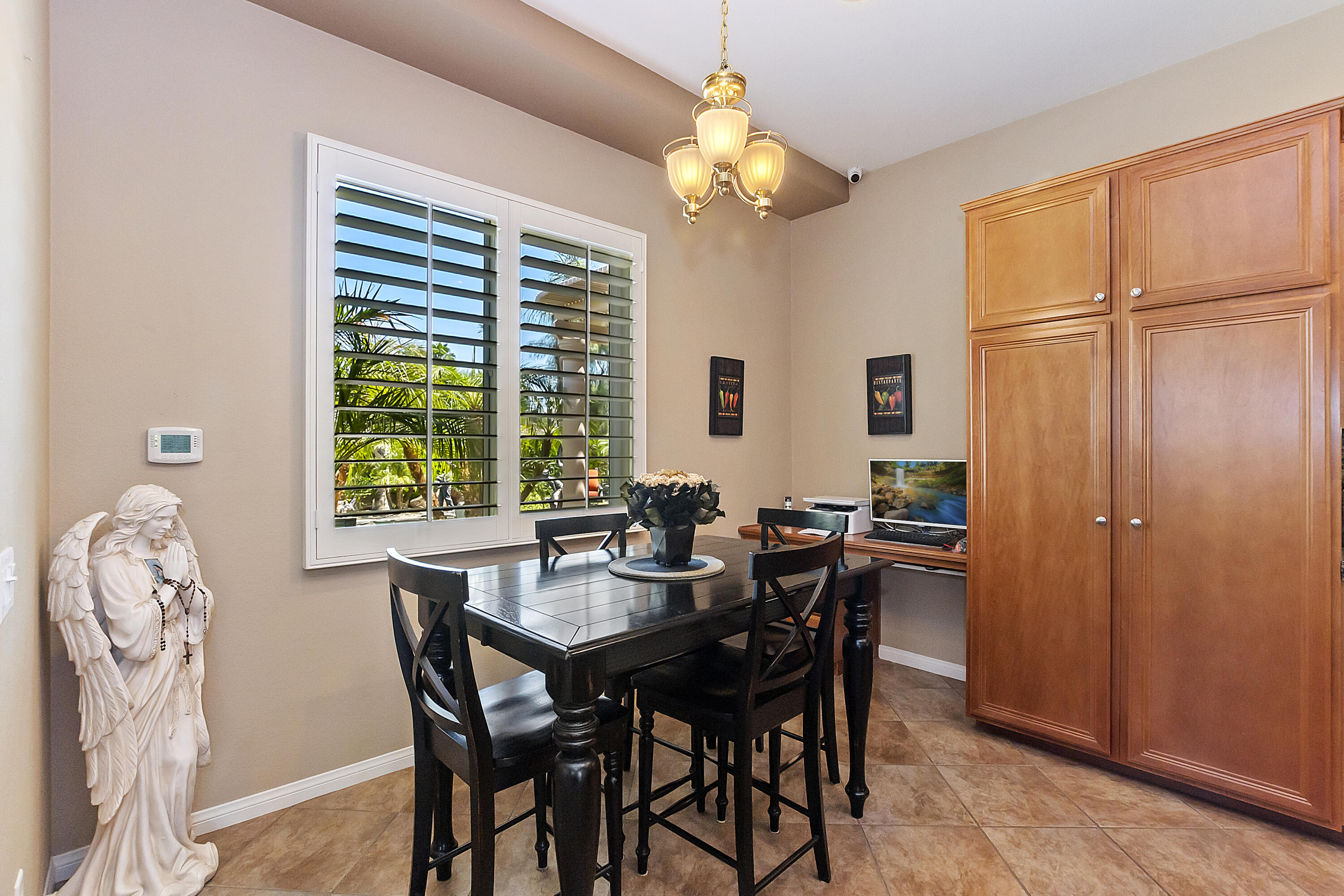 43328 Bordeaux Drive La Quinta, CA 92253 - Photo 12 of 38 a view of a dining room with furniture window and outside view