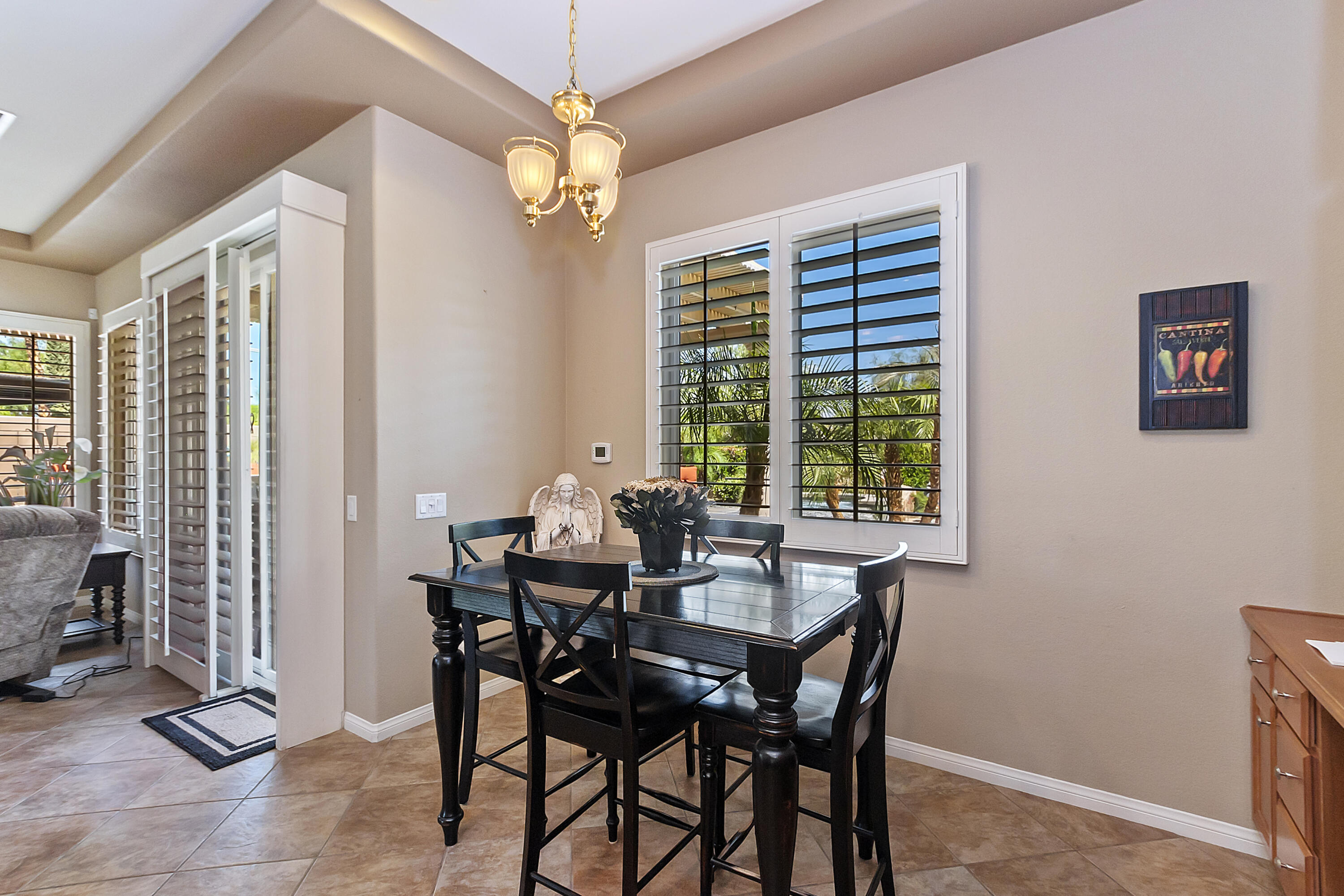 43328 Bordeaux Drive La Quinta, CA 92253 - Photo 13 of 38 a view of a dining room with furniture window and outside view