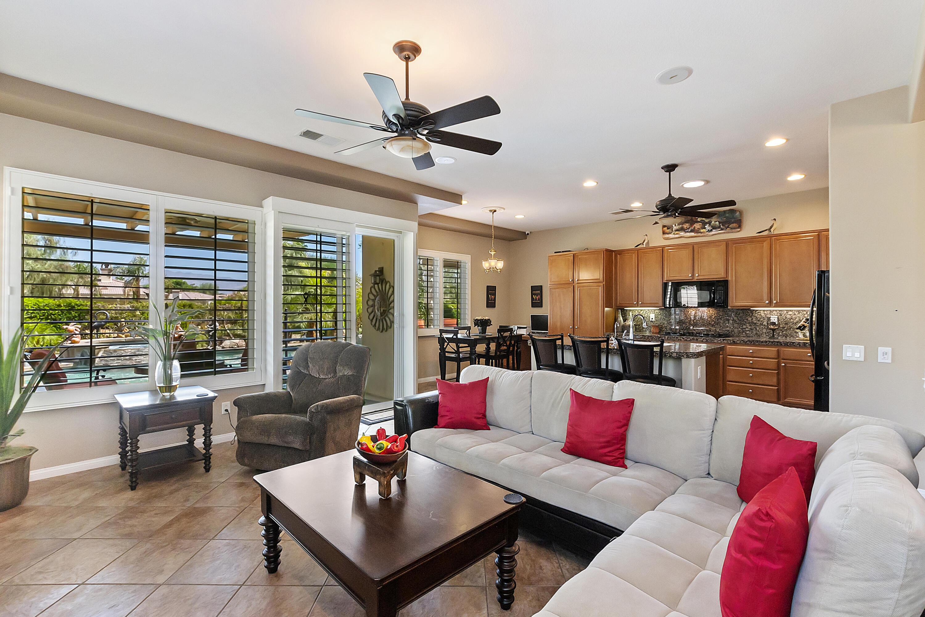 43328 Bordeaux Drive La Quinta, CA 92253 - Photo 14 of 38 a living room with furniture kitchen view and large windows