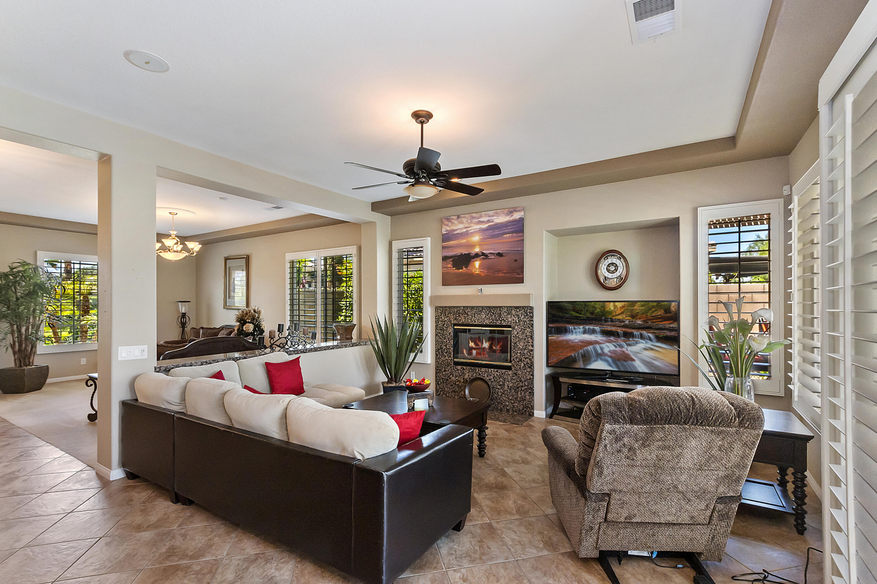 43328 Bordeaux Drive La Quinta, CA 92253 - Photo 15 of 38 a living room with fireplace furniture and a large window