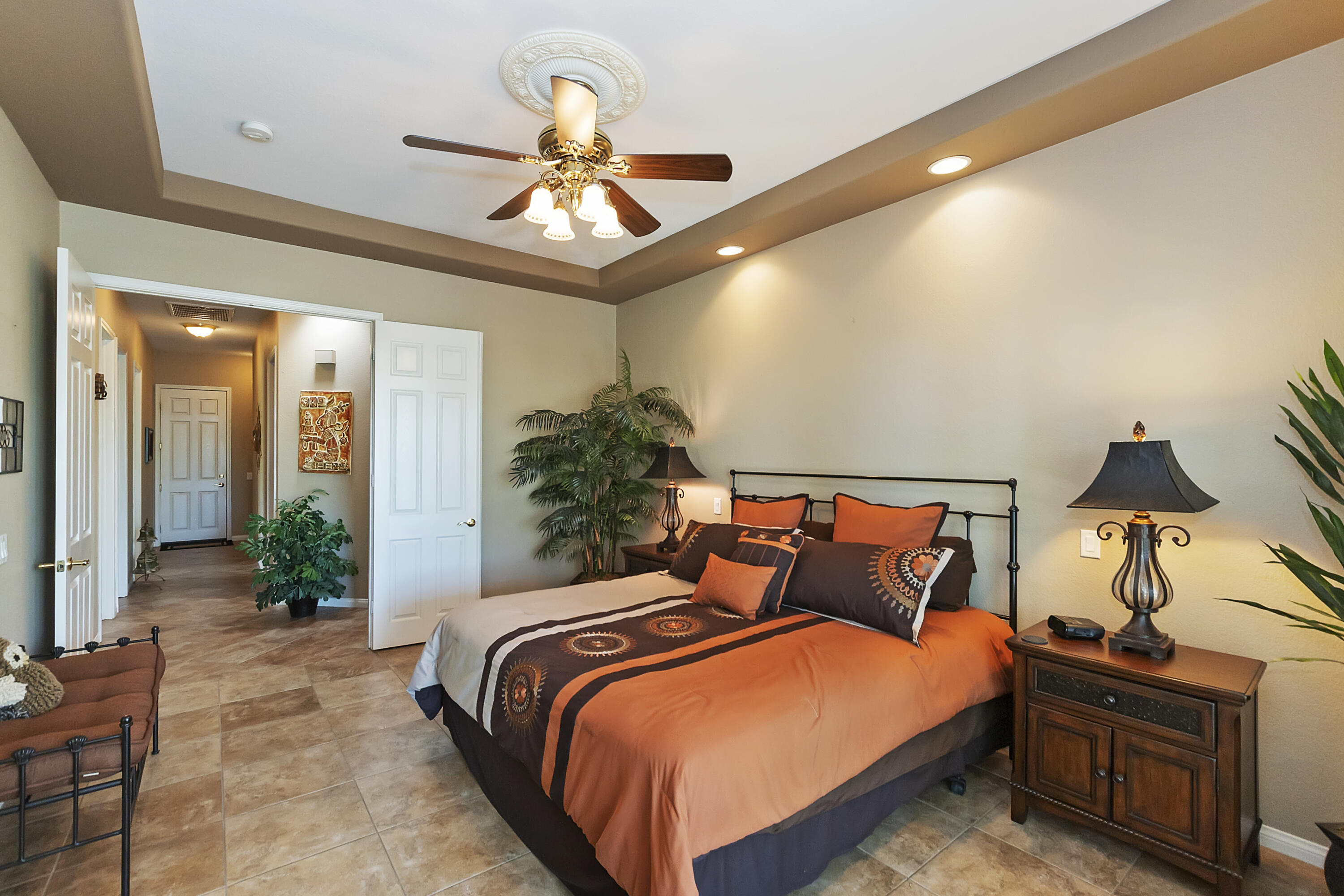 43328 Bordeaux Drive La Quinta, CA 92253 - Photo 24 of 38 a bedroom with a bed and a chandelier