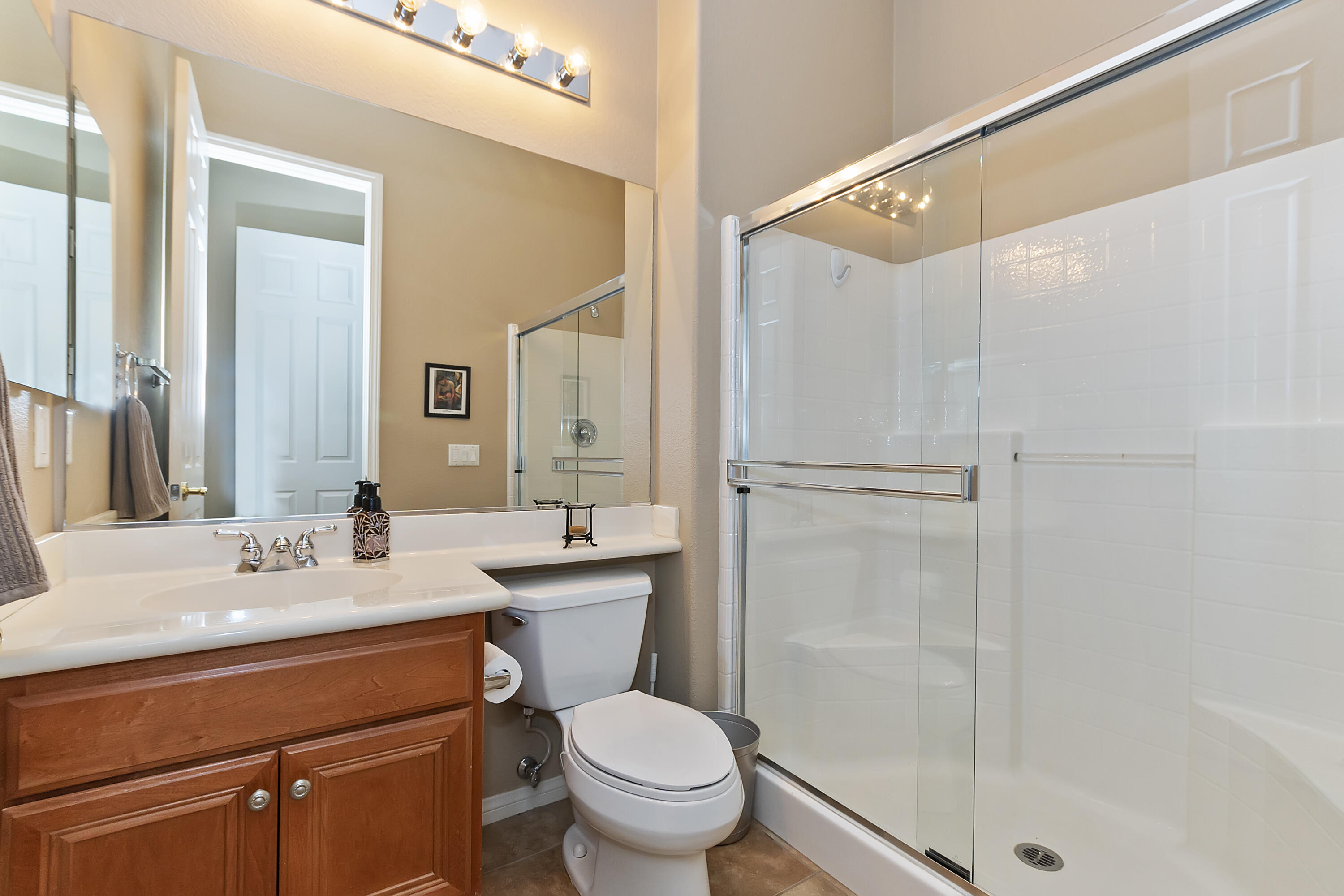 43328 Bordeaux Drive La Quinta, CA 92253 - Photo 28 of 38 a bathroom with a sink toilet and shower