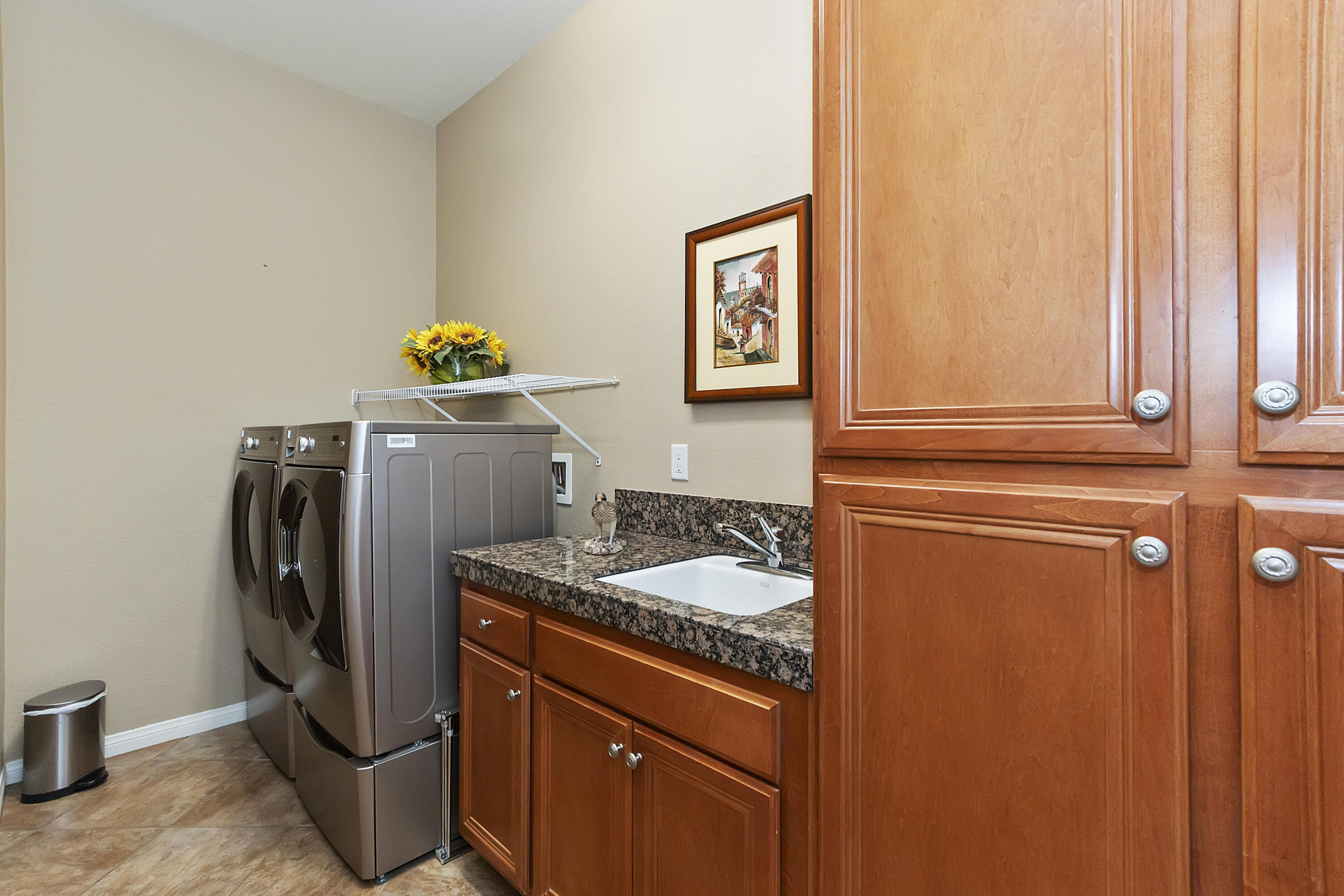 43328 Bordeaux Drive La Quinta, CA 92253 - Photo 30 of 38 a utility room with fridge and sink