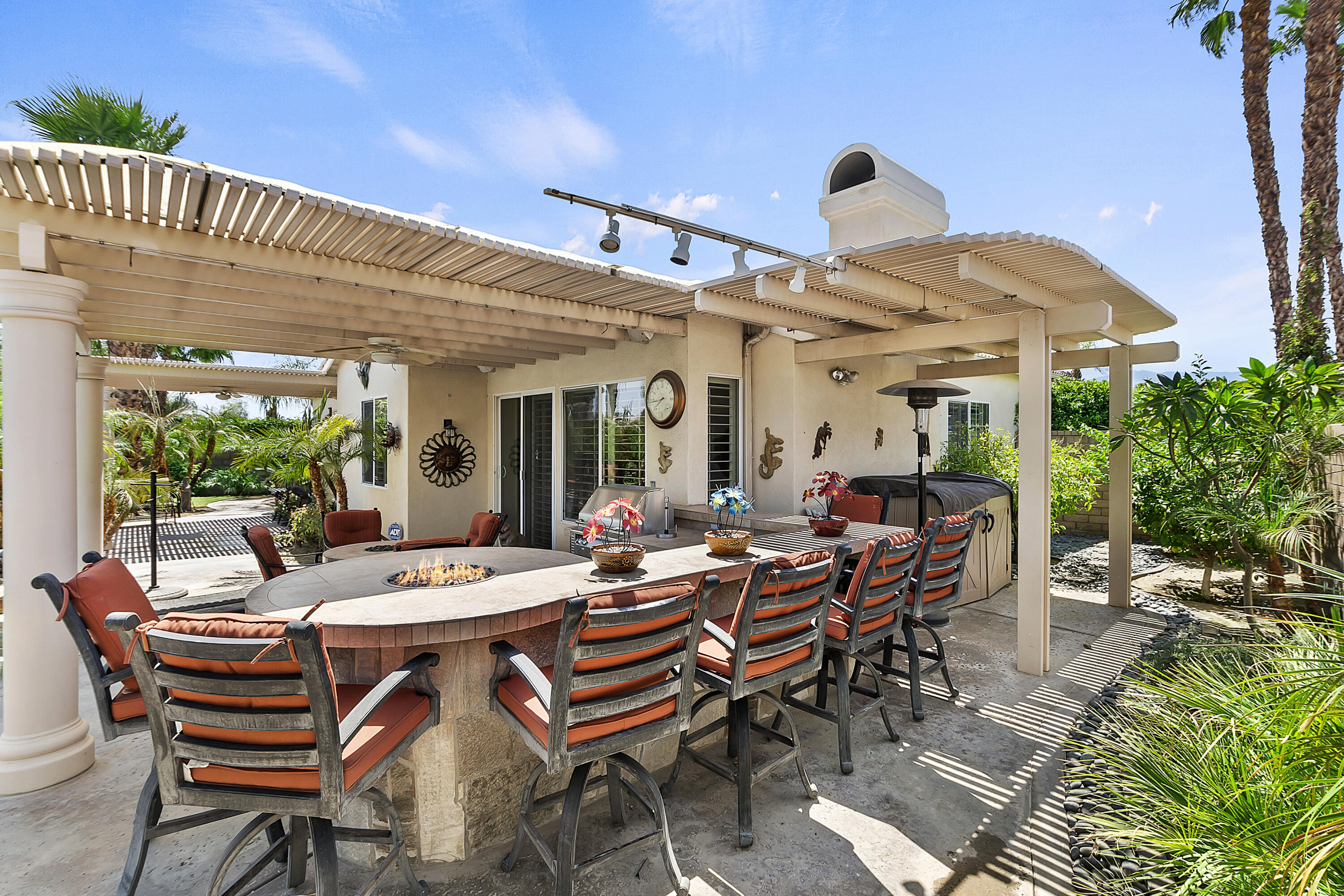 43328 Bordeaux Drive La Quinta, CA 92253 - Photo 31 of 38 a view of a patio with dining table and chairs with wooden floor