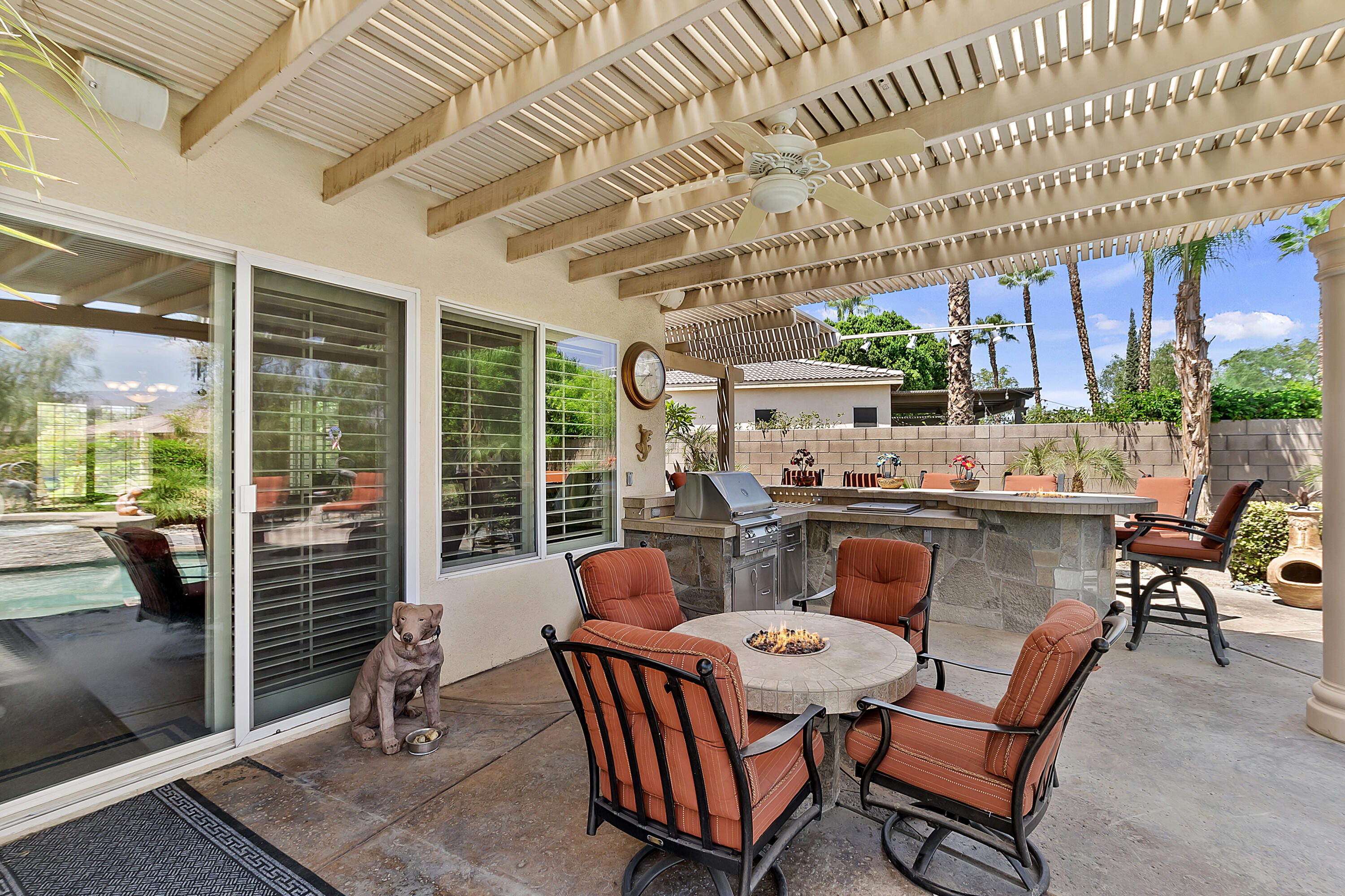 43328 Bordeaux Drive La Quinta, CA 92253 - Photo 34 of 38 a dining room with furniture and a floor to ceiling window