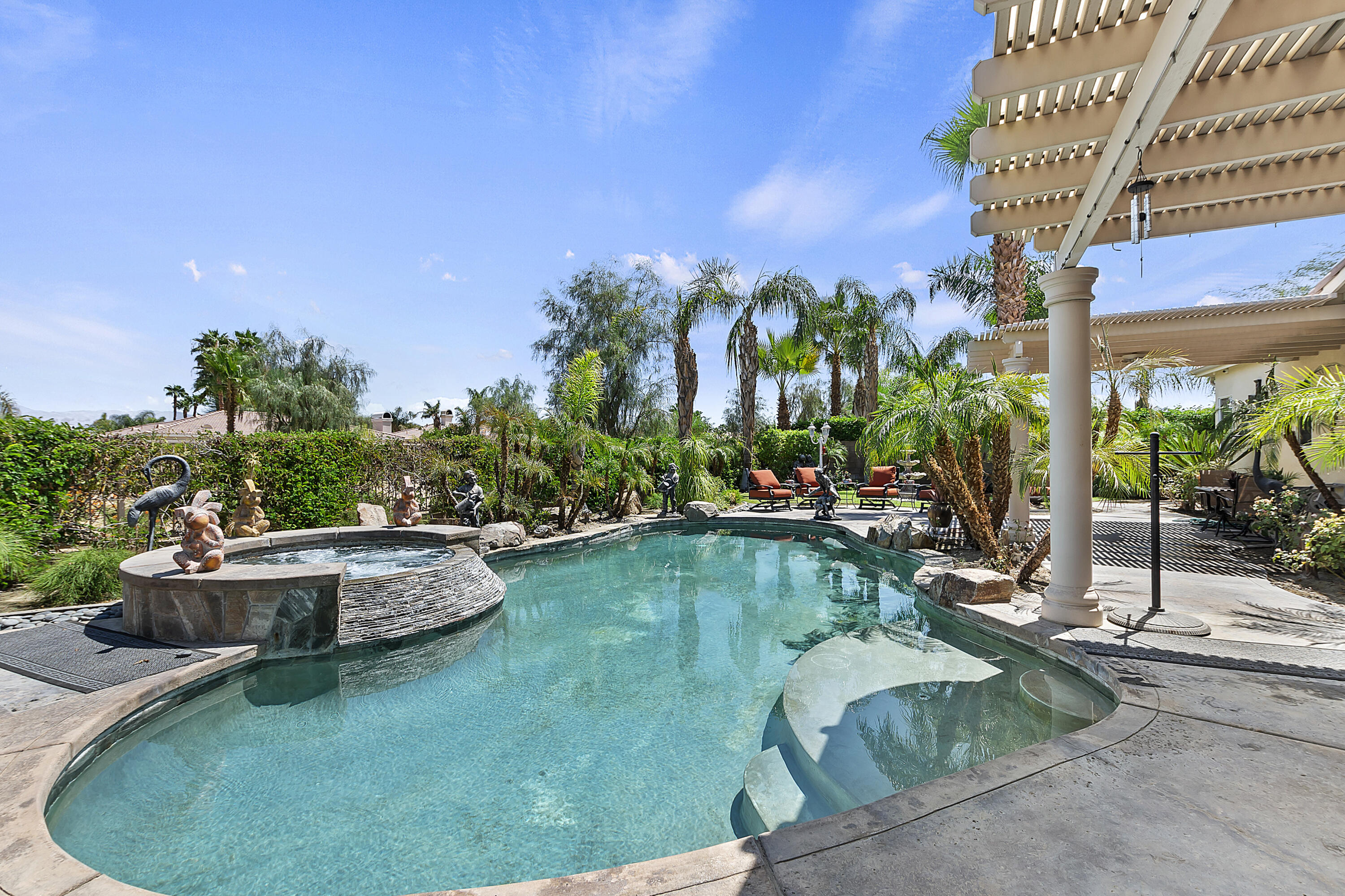 43328 Bordeaux Drive La Quinta, CA 92253 - Photo 35 of 38 a view of a swimming pool with sitting area