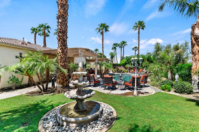 a view of a fountain in the garden