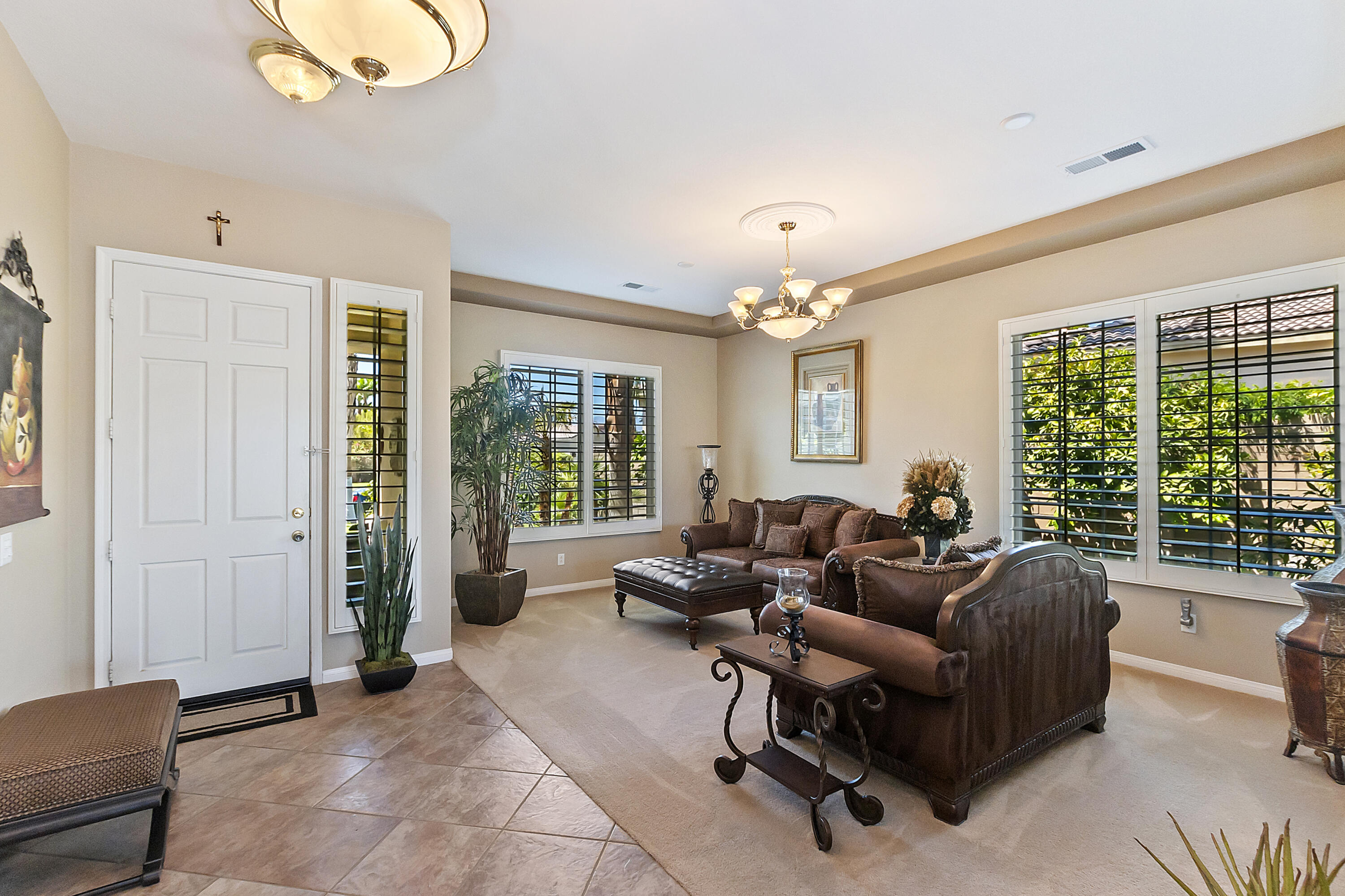 43328 Bordeaux Drive La Quinta, CA 92253 - Photo 5 of 38 a living room with furniture and a large window