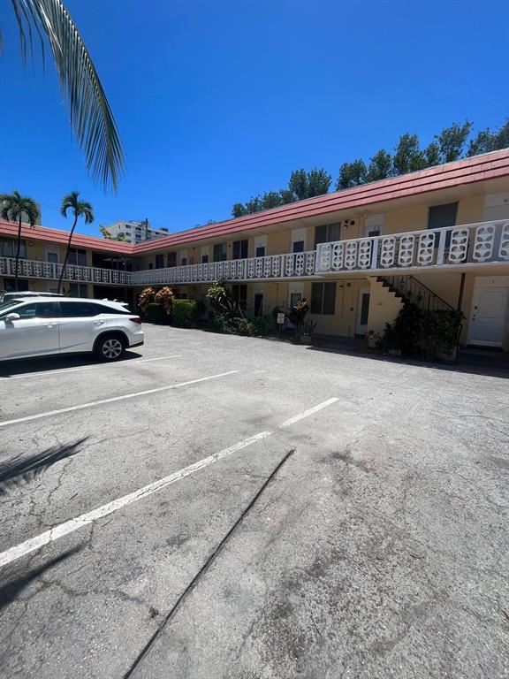 a view of a car park in front of a building