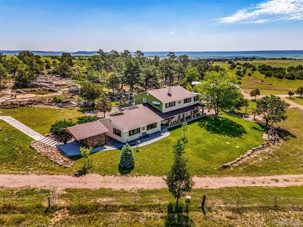 an aerial view of residential houses with outdoor space