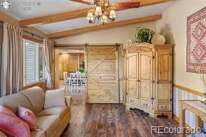 6100 Waterbarrel Road Beulah, CO 81023 - Photo 16 of 50 a living room with furniture and a chandelier