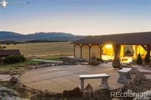 a wooden bench sitting in middle of a yard