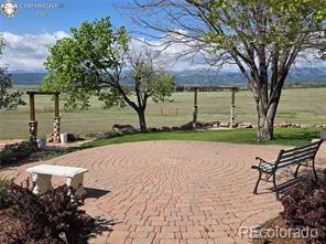6100 Waterbarrel Road Beulah, CO 81023 - Photo 40 of 50 a wooden bench sitting in middle of a yard