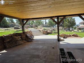6100 Waterbarrel Road Beulah, CO 81023 - Photo 45 of 50 a view of a porch with furniture and garden