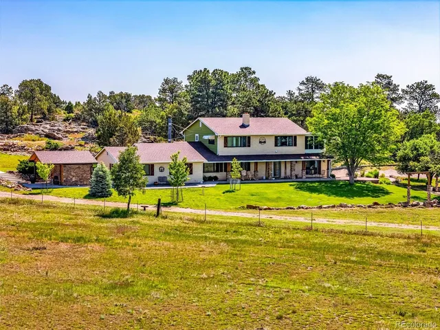 an aerial view of a house with a ocean view