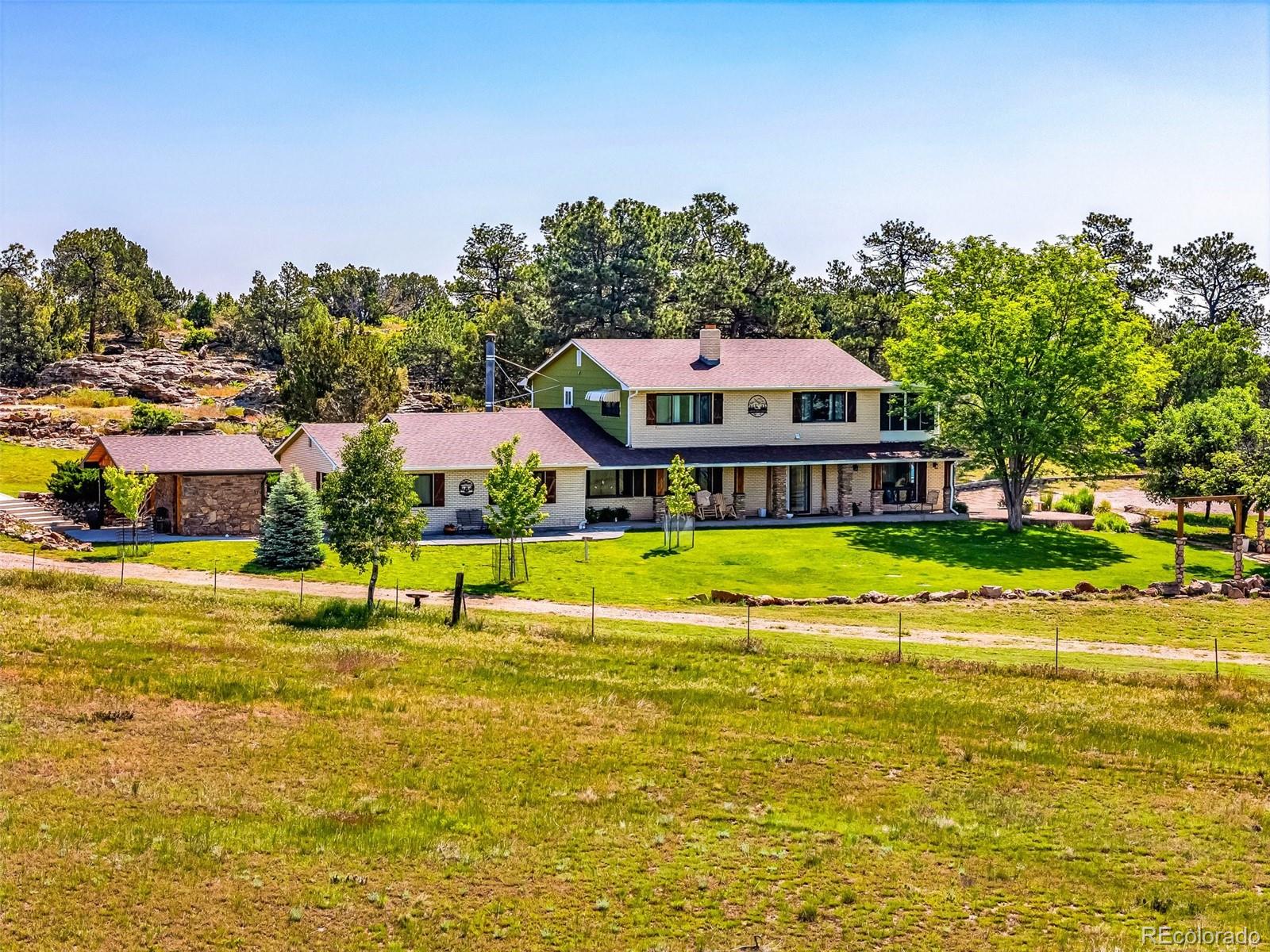 6100 Waterbarrel Road Beulah, CO 81023 - Photo 47 of 50 a view of swimming pool with outdoor seating and trees in the background