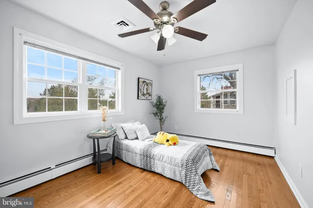 a bedroom with bed and a window