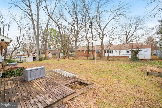a view of a yard with a house in the background