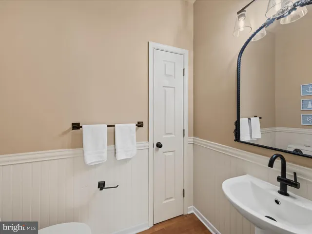 a bathroom with a sink and mirror