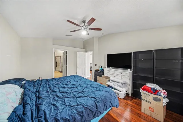 a large bathroom with a tub sink shower and mirror