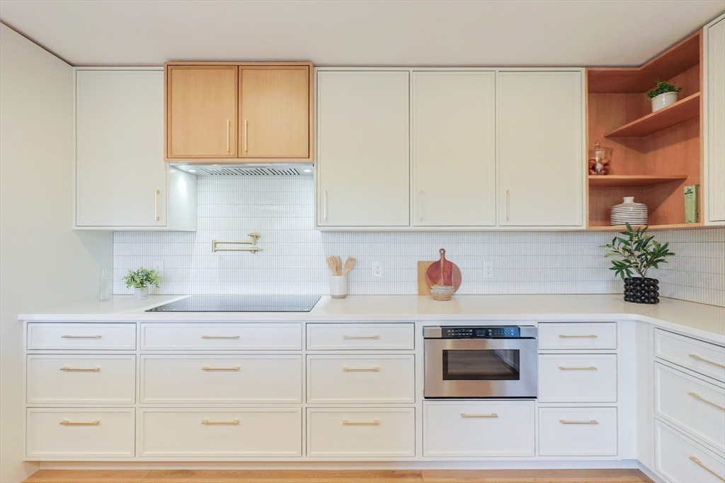 Lot 4 Pickering Road Blackstone, MA 01504 - Photo 5 of 19 a kitchen with white cabinets and white appliances