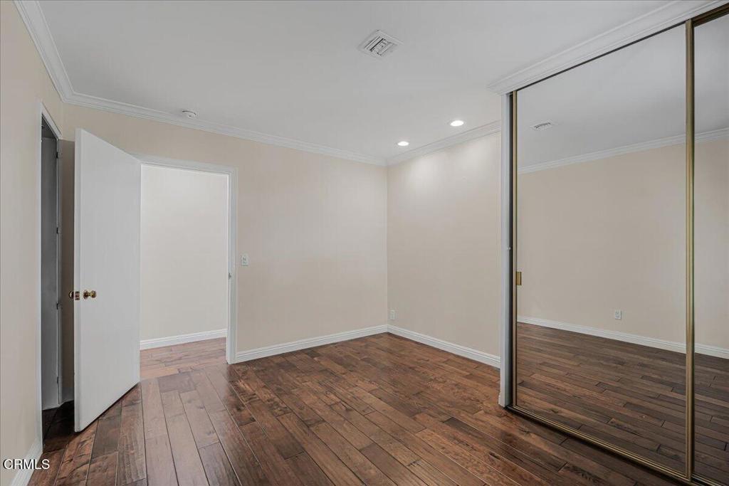 13902 Calvert Street Van Nuys, CA 91401 - Photo 18 of 33 a view of empty room with wooden floor