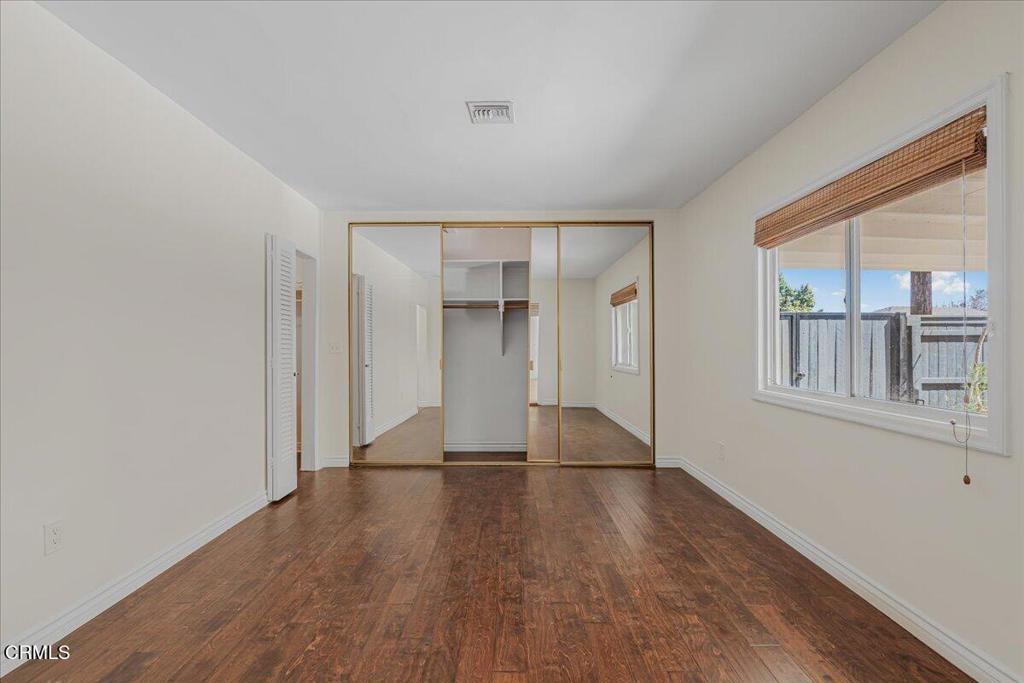 13902 Calvert Street Van Nuys, CA 91401 - Photo 24 of 33 a view of livingroom with hardwood floor and hallway