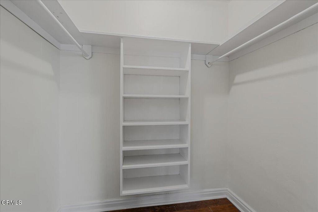 13902 Calvert Street Van Nuys, CA 91401 - Photo 25 of 33 a view of walk in closet with empty racks