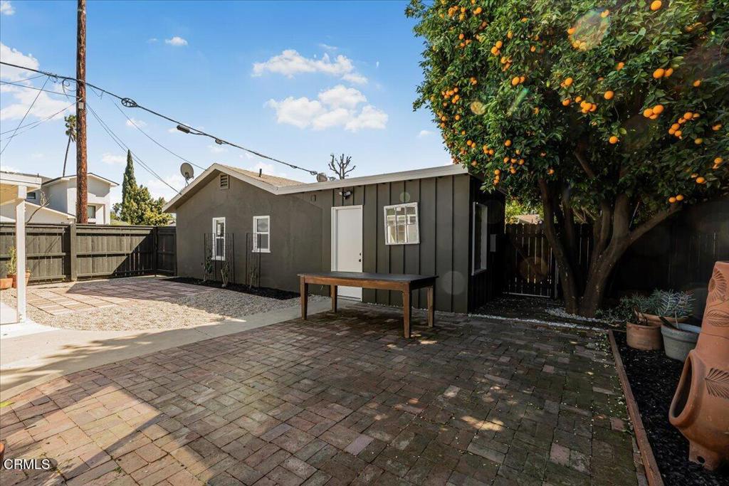 13902 Calvert Street Van Nuys, CA 91401 - Photo 27 of 33 a view of a house with backyard and sitting area