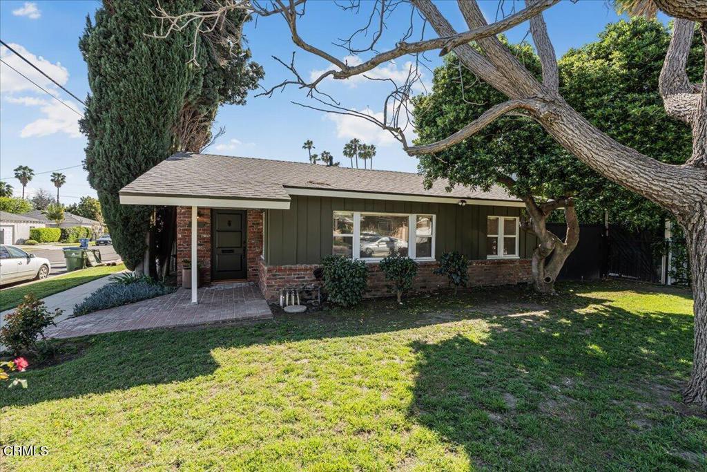13902 Calvert Street Van Nuys, CA 91401 - Photo 33 of 33 a front view of a house with a yard and porch
