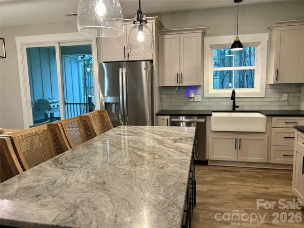 a view of kitchen and dining area with furniture