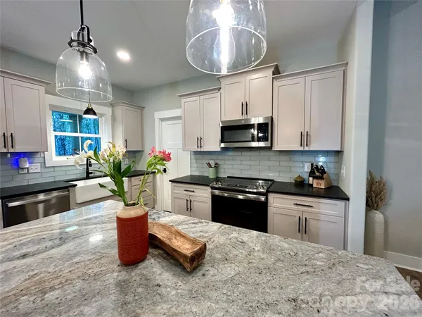 a kitchen with a stove and a cabinet