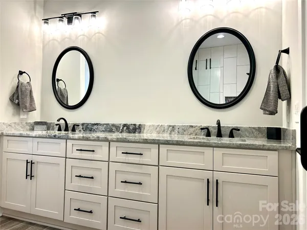 a bathroom with a shower and a sink