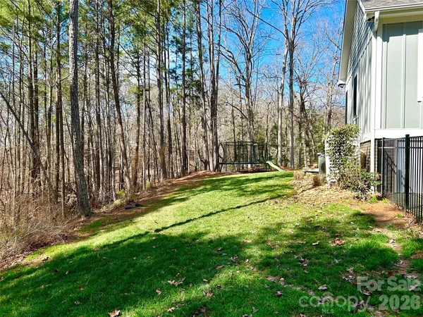 a front view of a house with a yard table and chairs